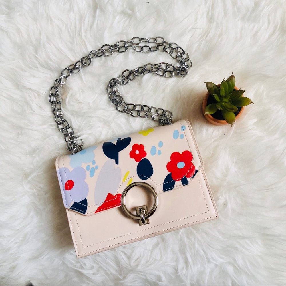 Off white flower print handbag with O ring buckle.
